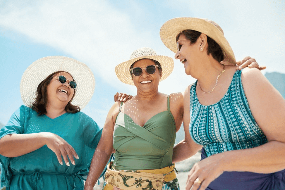 women smiling with sunhats