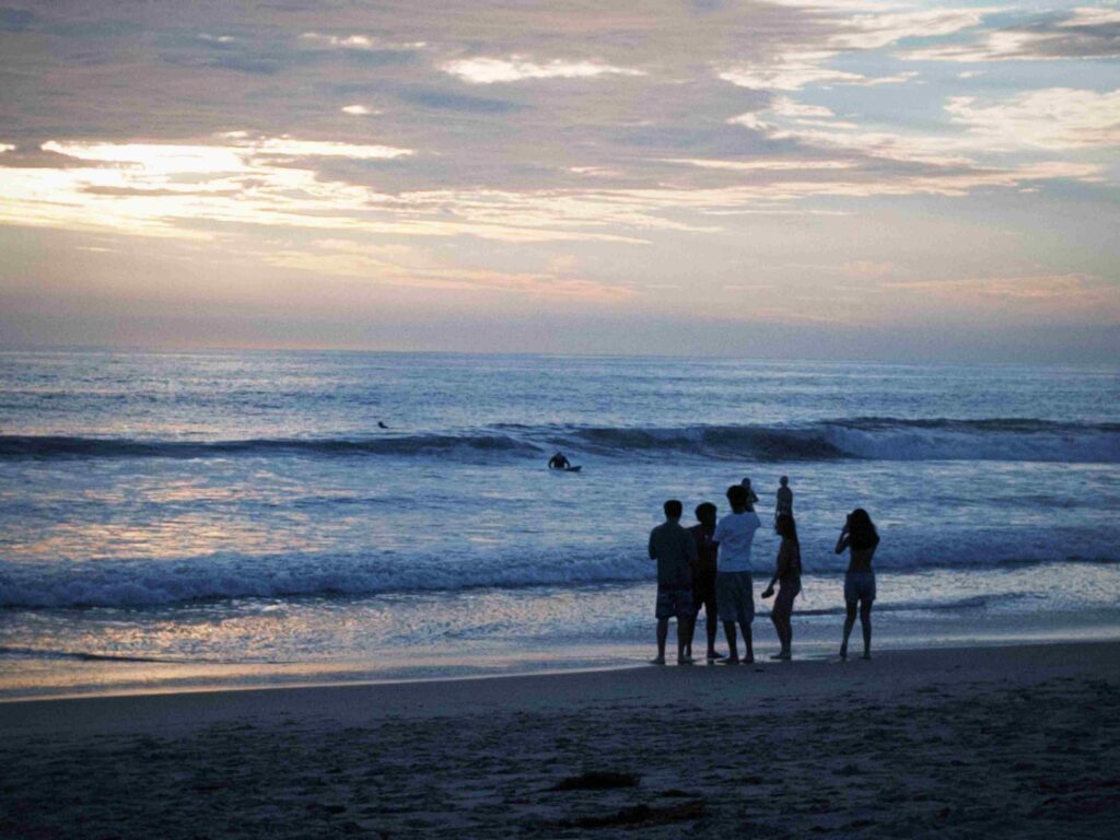 Vismai and friends at the beach near sunset